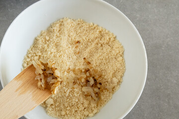 Adding fried onions to the butter-flour mixture.