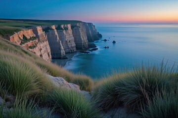 Stunning Marine Cliff Dusk Landscape with Coastal Grasses and Azure Sky