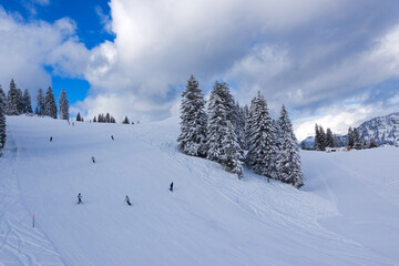 Snowy landscape with high angle view of ski slope at Swiss ski resort of Flumserberg on a winter day. Photo taken January 29th, 2025, Flumserberg, Switzerland.