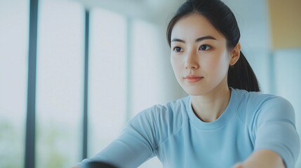 Young woman focused on activity indoors with natural light