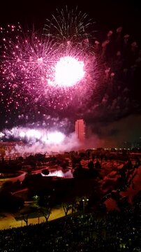 Colorful spectacular fireworks in Turia Park in Valenia. During the annual Fallas festival in spring in March. Long salutes of the masclet in the middle of the carnival of fire Las Fallas. Spain