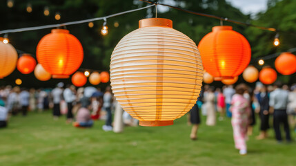 Fototapeta premium Japanese lanterns glowing at festive outdoor celebration