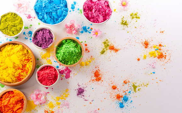 Happy Holi decoration, the indian festival.Top view of colorful holi powder on white background.