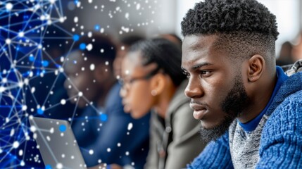 WE Day. Focused teenage boy working on a creative project in a bright classroom.