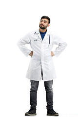 Doctor, full-length, on a white background, hands on hips