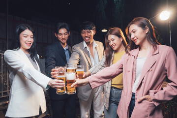Cheers to Friendship: A group of friends raise their glasses in a toast, celebrating camaraderie and good times.  Their laughter and genuine smiles create a warm and inviting atmosphere.