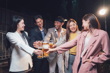 Night Out Cheers: A group of friends toasting with beers, their faces lit by the warm glow of a street lamp, capturing the joy and camaraderie of a night out.