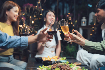 Friends Toast:  A group of friends clink glasses of red wine and champagne, raising a toast to friendship, laughter, and good times.