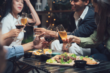 Evening Gathering of Friends: A diverse group of friends enjoy a lively evening together, sharing drinks and appetizers. Laughter and good company fill the air.