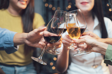 Cheers to Friendship: Close friends raise their glasses in a toast, capturing the joy and warmth of shared moments and genuine connection.