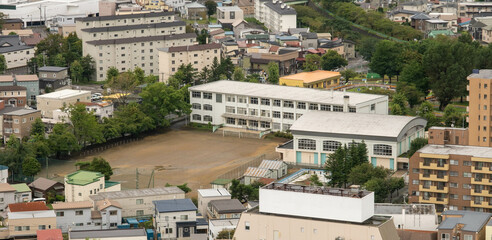 The outside courtyard, playing field, and gymnasium of Hakodate Shiritsu Chiyoda Elementary School, Hokkaido, Japan. High-quality photo