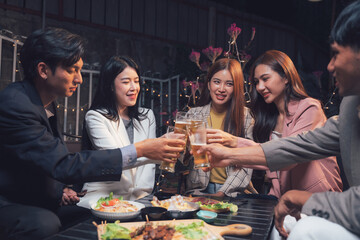 Nighttime Cheers: A group of stylish young adults raise their glasses in a toast, their faces lit by the warm glow of the restaurant's ambiance.  The scene is filled with laughter and camaraderie.