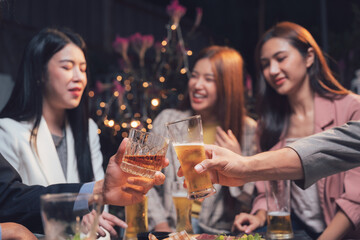Nightlife Cheers: Friends raise their glasses in a toast, their laughter and smiles illuminating a cozy, dimly lit gathering. The scene is filled with warmth and camaraderie.