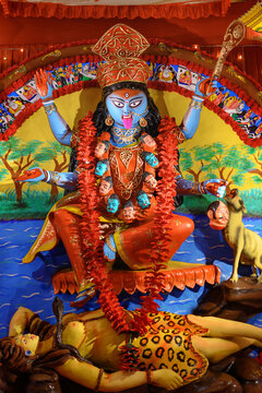 Idol of Goddess Maa Kali at a decorated puja pandal in West Bengal, India, during Kali puja, a famous religious festival of Hinduism.