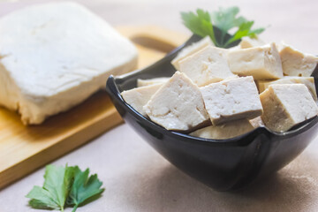 pieces of white tofu in a bowl on the table