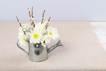 Florist at work: How to make floral arrangement with gypsophila paniculata twigs, chrysanthemums and catkins inside silver watering can. Easter decor idea. Step by step, tutorial.