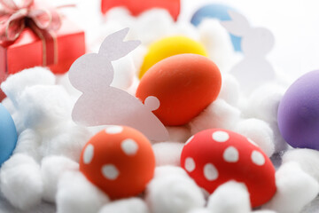 Happy Easter eggs and gift boxes on white background. Easter decoration.