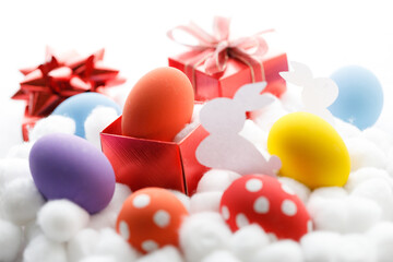 Happy Easter eggs and gift boxes on white background. Easter decoration.