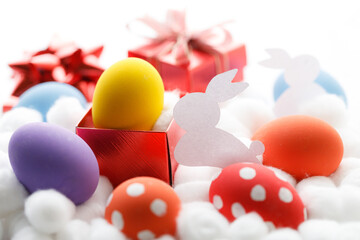 Happy Easter eggs and gift boxes on white background. Easter decoration.