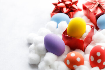 Happy Easter eggs and gift boxes on white background. Easter decoration.