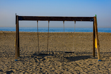 Children's playground on the beach. Empty outdoor children playground on beach 