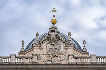 Ancient dome and capital structure with symbols in the Royal Palace, Madrid, Spain.