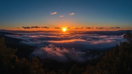 Fototapeta premium Mountaintop Sunset Over Sea of Clouds