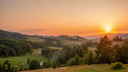 Scenic mountain landscape at sunset with rolling hills and forests (Pieniny Mountains - Biala Woda Reserve)