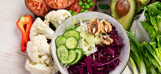 Table full with organic vegetables for making salad.