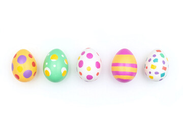 row of six decorated Easter eggs with colorful patterns