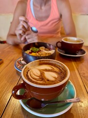 A cup of coffee cappuccino or latte on the table