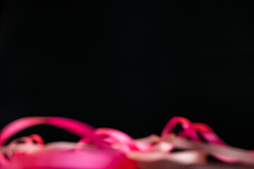tangled pink ribbon love romance valentine symbol women awareness black background blur