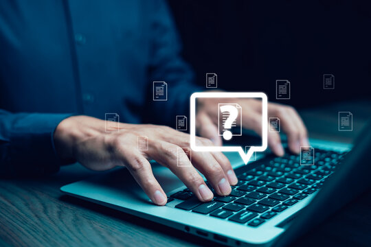 Online customer support and digital assistance concept. A person types on a laptop with a glowing question mark icon, symbolizing help desk services, FAQs, troubleshooting, and IT support