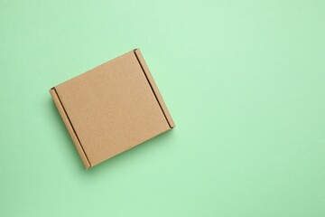 Cardboard box on color background