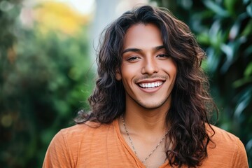 Fototapeta premium Hispanic Transgender Man in Casual Attire, Radiating Confidence with a Bright Smile and Long Hair
