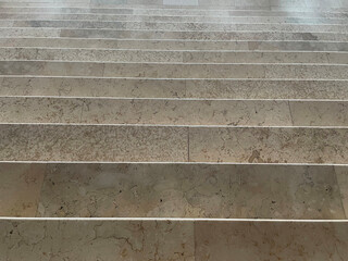 Marble floor of the stairs. Horizontal line pattern of marble material as a design background. Dark marble material stair floor