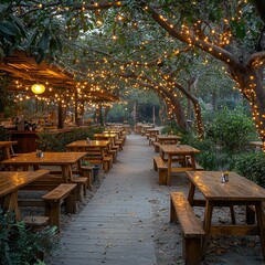Fototapeta premium Cozy outdoor dining area adorned with fairy lights, surrounded by greenery, creating a warm atmosphere for gatherings