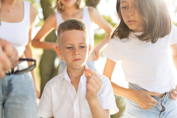 Fototapeta premium Children exploring nature together in summer