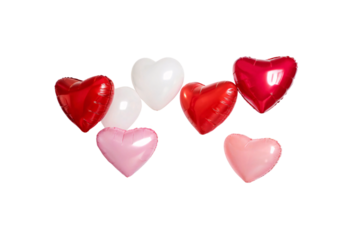 A cluster of heart-shaped balloons in red, white, and pink hues, floating gracefully against a black background, exuding vibrant romance and celebration, isolated on a transparent background
