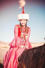 Kazakh woman and man in national costumes