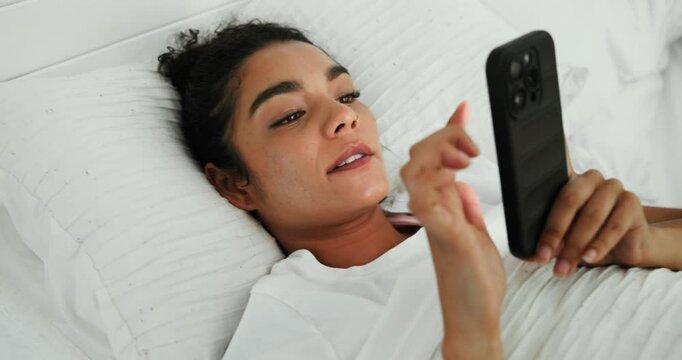Phone, woman and scroll in bedroom for social media, dating app or internet browsing in home. Notification, bed and female person relax with smartphone for web article, communication or networking