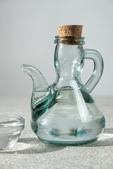 Classic table vinegar in a vinegar container cruet with a cork