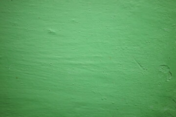 Bright green textured surface in a contemporary urban setting