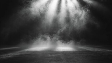 Abstract black background featuring ethereal smoke and fog illuminated by soft rays of light creating a dramatic and mysterious atmosphere