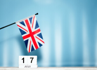 July Calendar With British Flag With Number  17. Calendar cubes with numbers. Space copy.