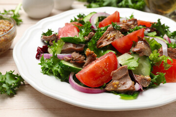 Delicious fresh tuna salad on wooden table, closeup