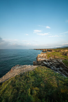 Stunning Coastal View of Santander, Spain with Rocky Cliffs and Clear Blue Sky