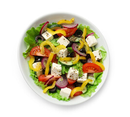 Delicious fresh Greek salad in bowl on white background, top view