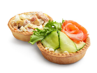 Tartlets with delicious fillings isolated on white