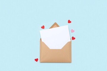 Solid light blue bg brown paper envelope with red heart decors